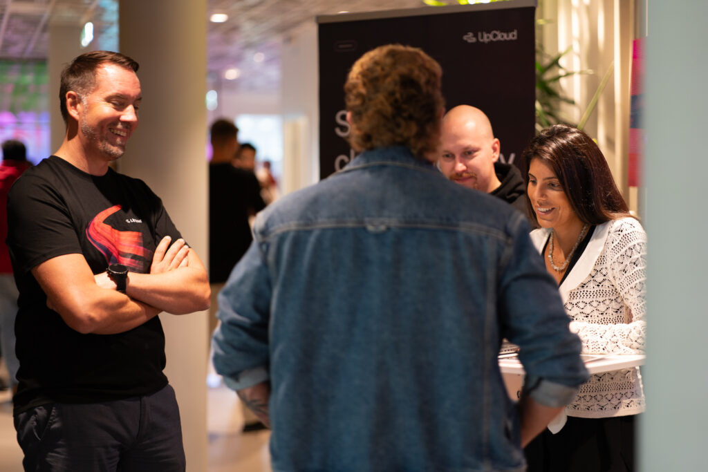 People engaging in conversation at UpCloud Connect Stockholm 2025.