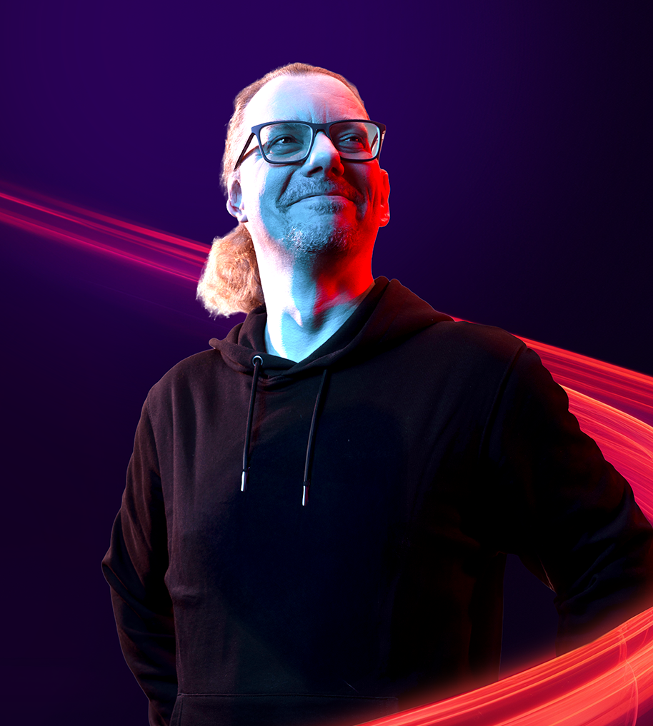 Man with glasses beside neon trials